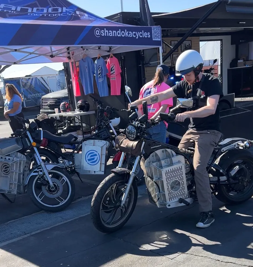Riders trying Shandoka motorcycles at our tent at Micromobility America 2024