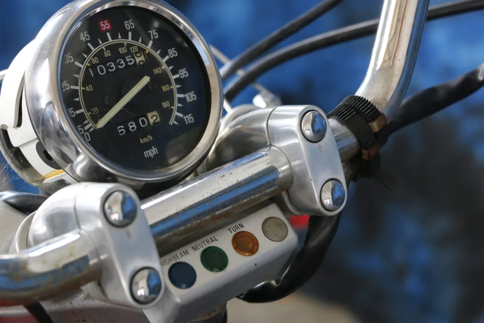 A motorcycle speedometer and odometer, up close