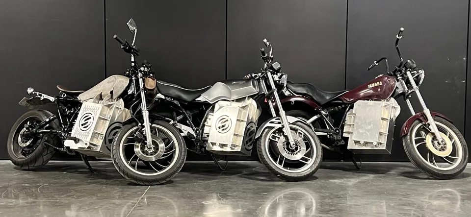 Three Yamaha motorcycles with Shandoka conversions in the Detroit shop