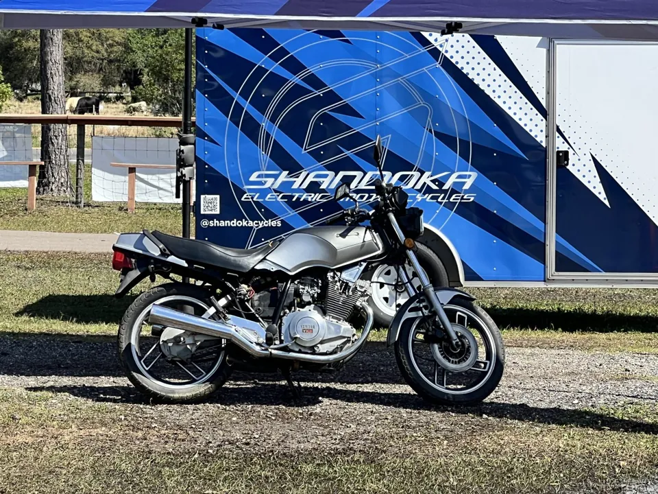 A Yamaha with the Shandoka conversion parked in front of the Shandoka trailer