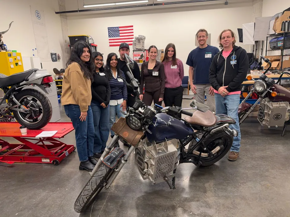 College for Creative Studies students with a Shandoka motorcycle in the shop