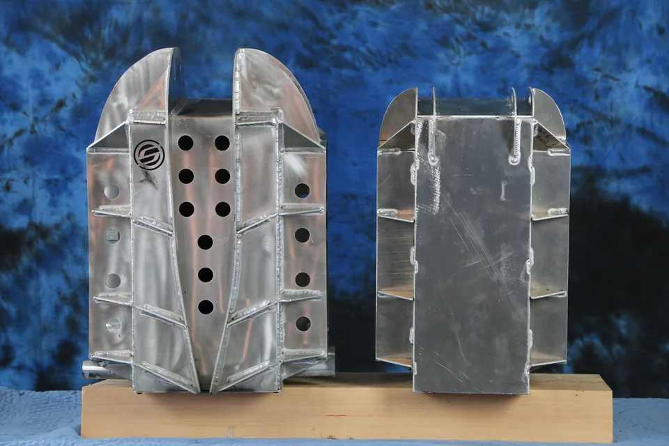 Two finished Shandoka adapter case sections side by side on a wooden block.