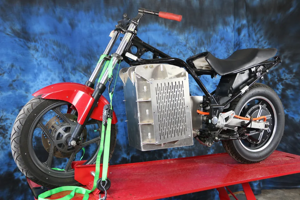 The Ninja 250 frame with the Shandoka battery pack fitted where the engine was and the hub motor in the rear wheel.
