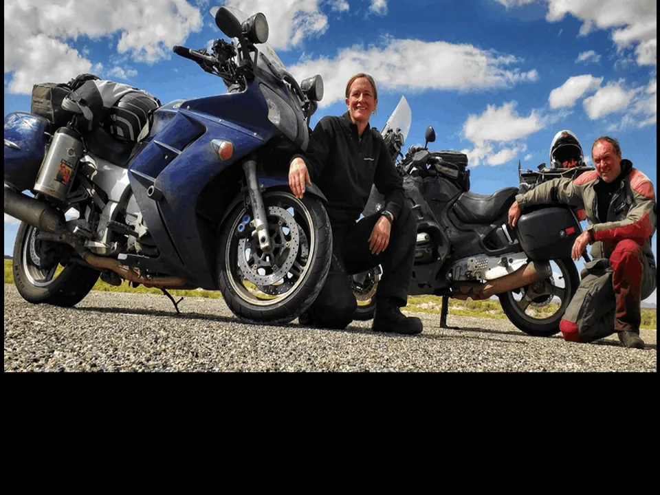 Wendy Crockett and Ian McPhee with an FJR1300 and their riding gear.